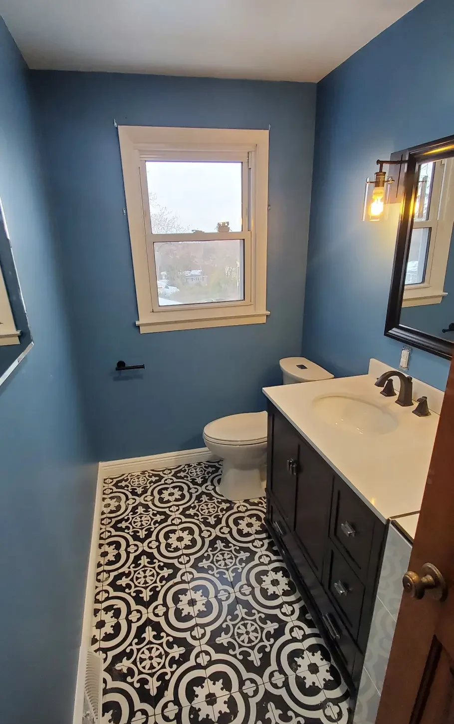 Patterned tile floor & vanity