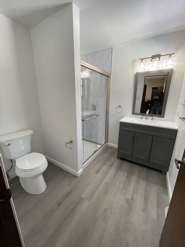 Marble shower & gray vanity