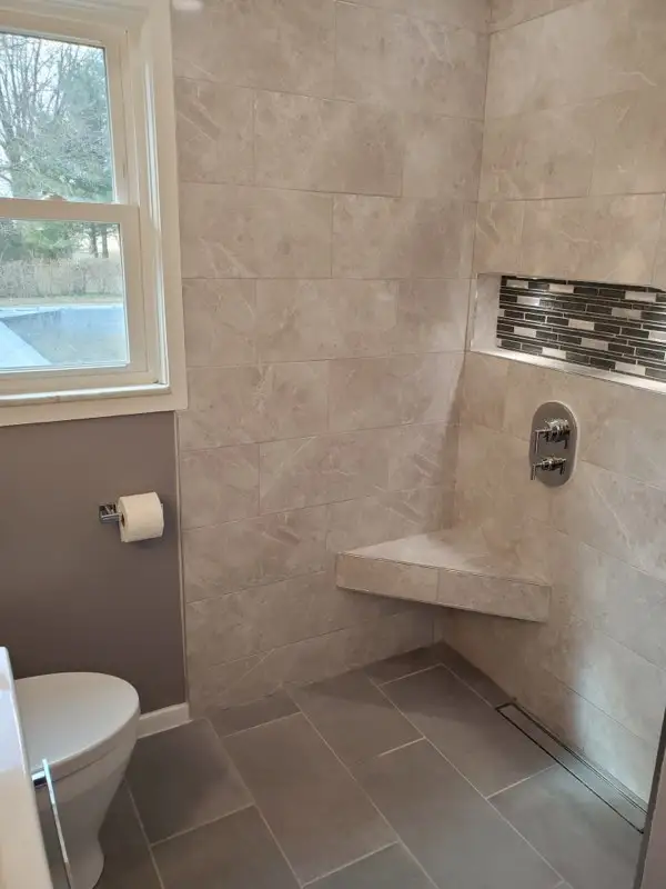 Walk-in shower with tile bench