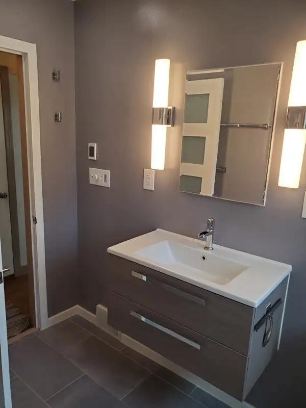 Floating vanity with LED sconces