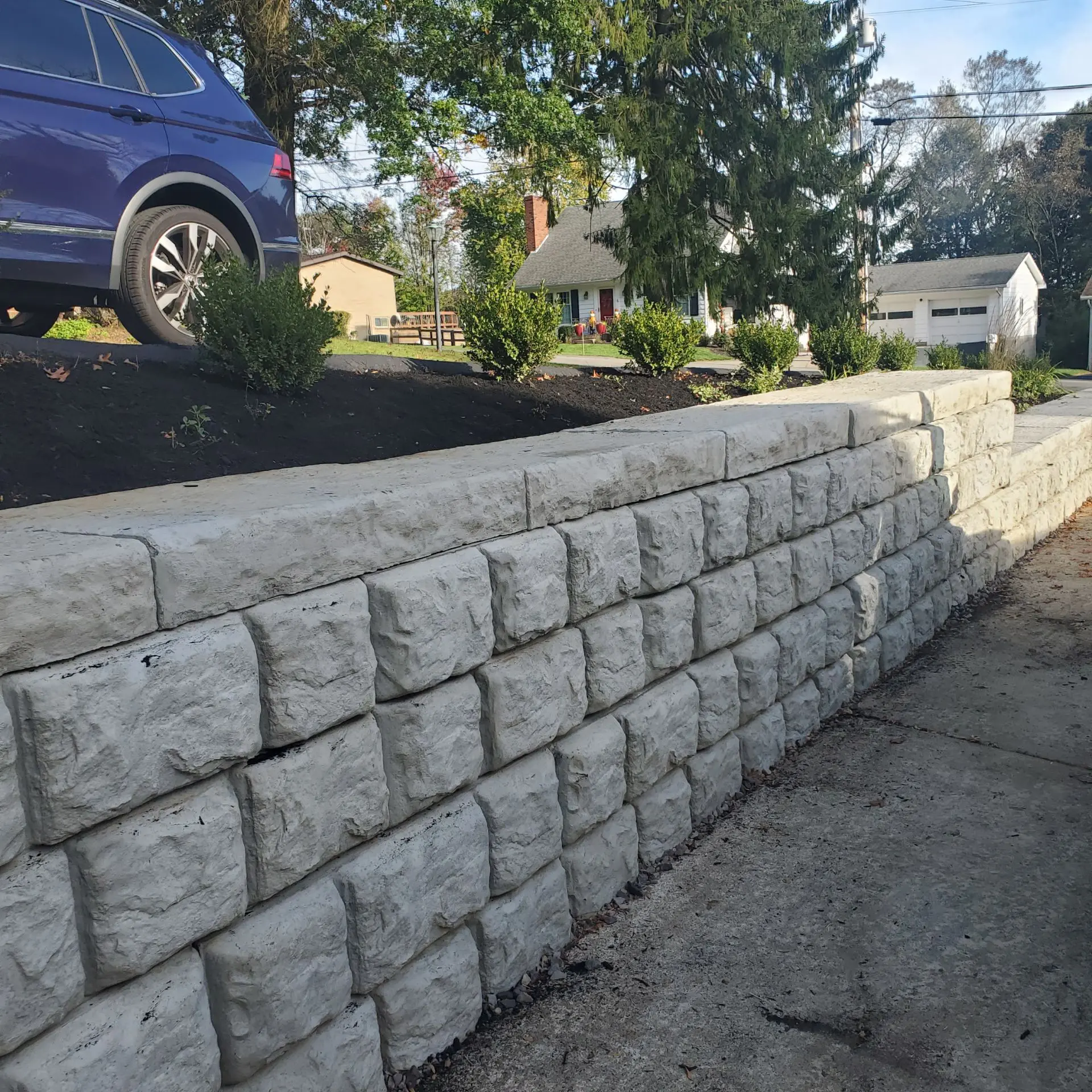Rock-face block retaining wall