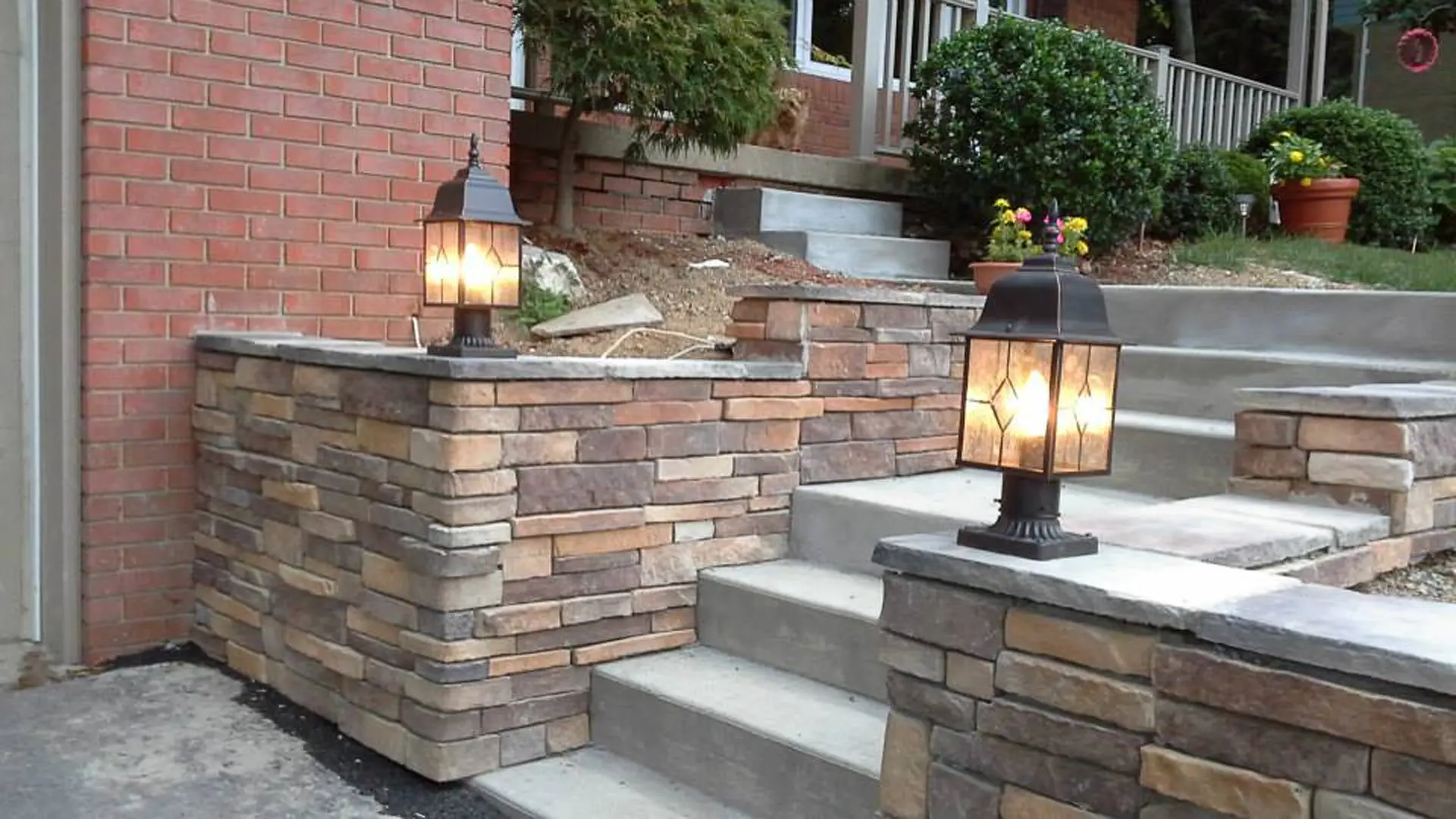 Stacked stone wall with lanterns
